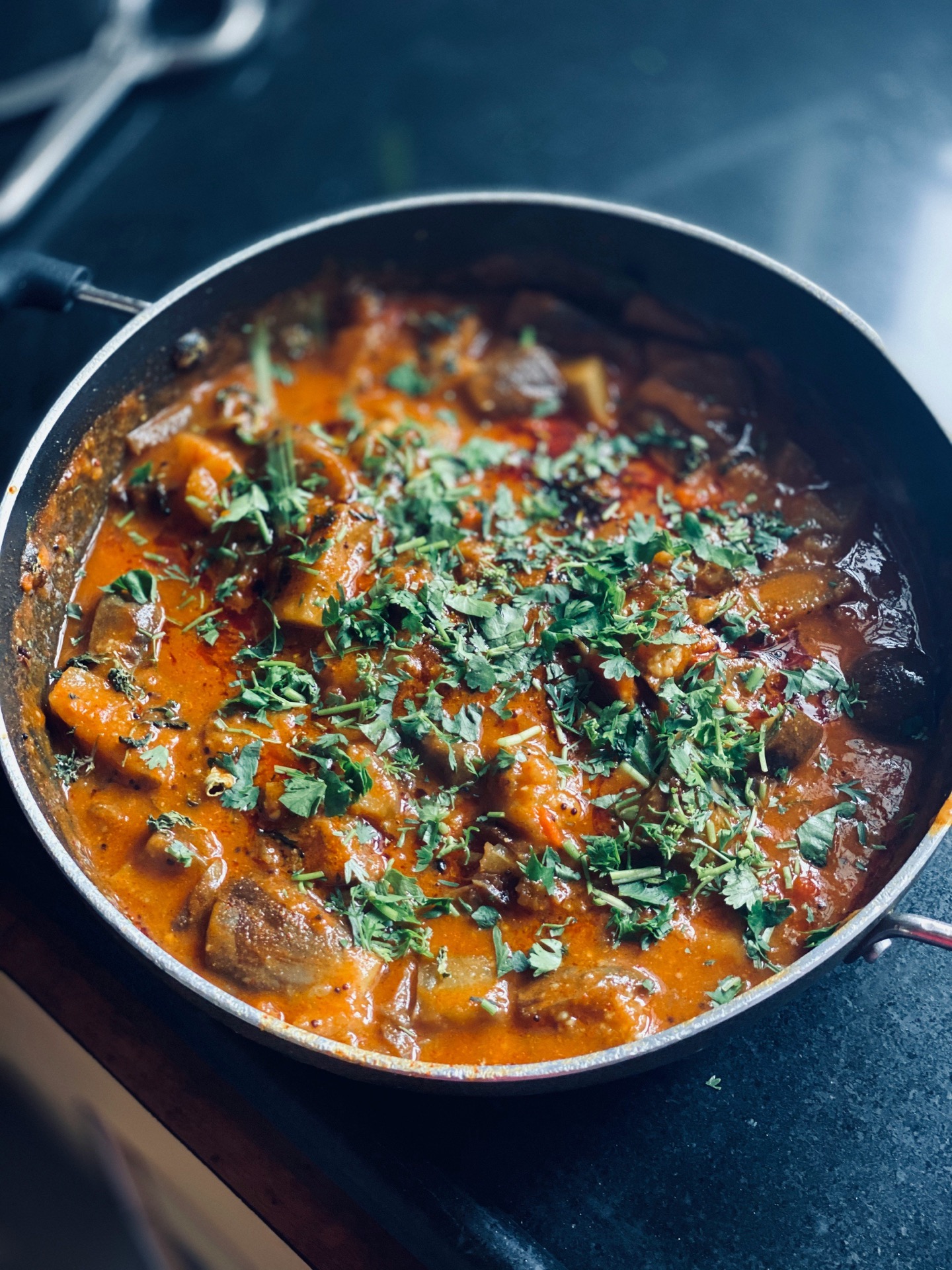 Simmering sabzi in a black pot